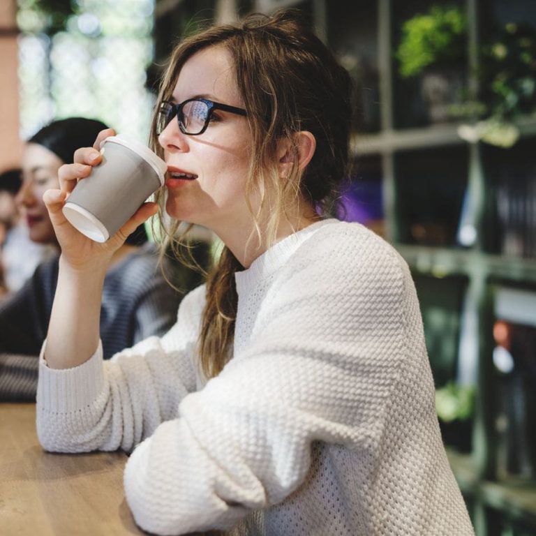 Blond woman having a cup of coffee